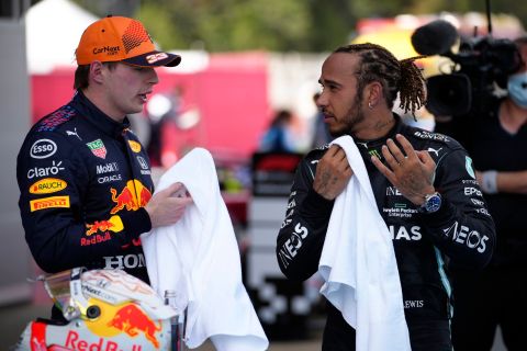 Mercedes driver Lewis Hamilton of Britain talks with second placed Red Bull driver Max Verstappen of the Netherlands, left, after winning the Spanish Formula One Grand Prix at the Barcelona Catalunya racetrack in Montmelo, just outside Barcelona, Spain, Sunday, May 9, 2021. (AP Photo/Emilio Morenatti, Pool)