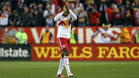 New York Red Bulls Thierry Henry acknowledges the crowd as he leaves the game against the D.C. United during the second half of an MLS playoff soccer match, Sunday, Nov. 2, 2014, in Harrison, N.J. (AP Photo/Adam Hunger)