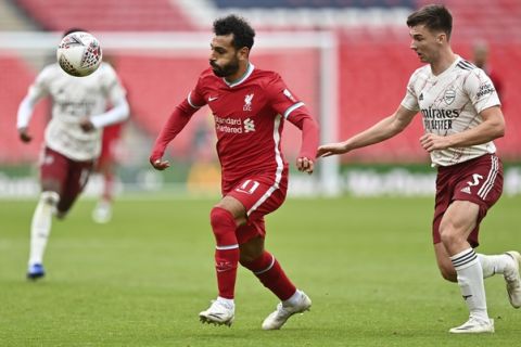 Liverpool's Mohamed Salah, center, runs for the ball during the English FA Community Shield soccer match between Arsenal and Liverpool at Wembley stadium in London, Saturday, Aug. 29, 2020. (Justin Tallis/Pool via AP)