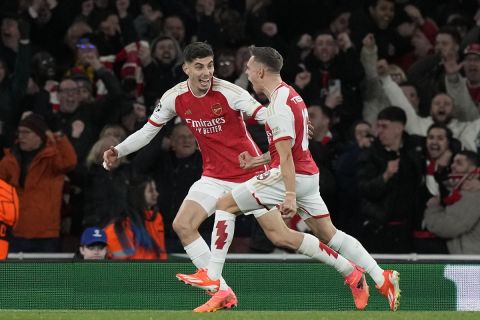 Arsenal's Leandro Trossard, right, celebrates with Arsenal's Kai Havertz, left, after scoring his side's second goal during the Champions League quarter final first leg soccer match between Arsenal and Bayern Munich at the Emirates Stadium, London, Tuesday, April 9, 2024. (AP Photo/Frank Augstein)