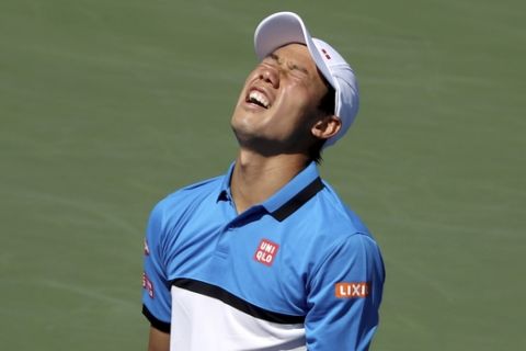 Kei Nishikori, of Japan, reacts after losing a point to Alex de Minaur, of Australia, during round three of the US Open tennis championships Friday, Aug. 30, 2019, in New York. (AP Photo/Kevin Hagen)