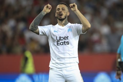 Marseille's Dario Benedetto celebrates after scoring during the French League One soccer match between Nice and Marseille at the Allianz Riviera stadium in Nice, southern France, Wednesday, Aug. 28, 2019. (AP Photo/Daniel Cole)