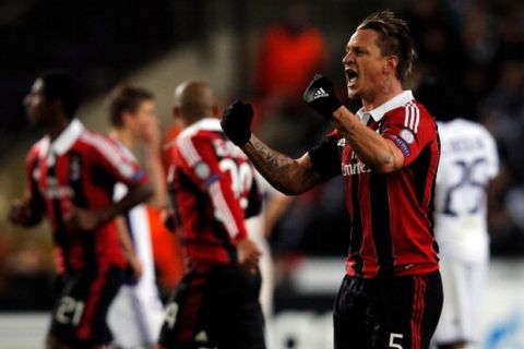 ANDERLECHT, BELGIUM - NOVEMBER 21:  Philippe Mexes (#5) of AC Milan celebrates scoring a goal during the UEFA Champions League Group C match between RSC Anderlecht and AC Milan at the Constant Vanden Stock Stadium on November 21, 2012 in Anderlecht, Belgium.  (Photo by Dean Mouhtaropoulos/Getty Images)