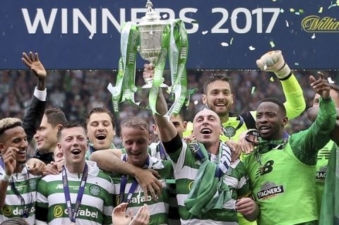 Celtic's players celebrate after winning the Scottish Cup final against Aberdeen at Hampden Park, Glasgow, Scotland, Saturday, May 27, 2017. (Jeff Holmes/PA via AP)