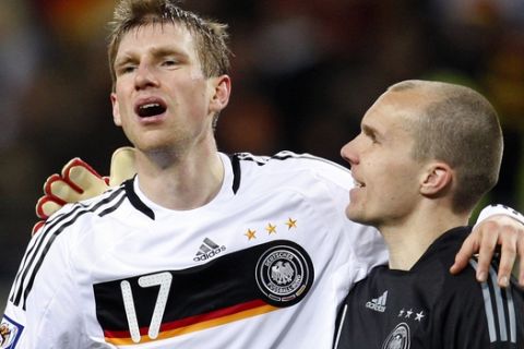 Germany's Per Mertesacker, left, and goalkeeper Robert Enke, right, are seen after a World Cup group 4 qualifying soccer match between Germany and Liechtenstein in Leipzig, Germany, Saturday, March 28, 2009. Germany defeated Liechtenstein by 4-0. (AP Photo/Michael Sohn)