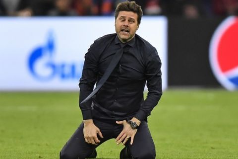Tottenham manager Mauricio Pochettino celebrates on the pitch after his team scored their third goal during the Champions League semifinal second leg soccer match between Ajax and Tottenham Hotspur at the Johan Cruyff ArenA in Amsterdam, Netherlands, Wednesday, May 8, 2019. (AP Photo/Martin Meissner)