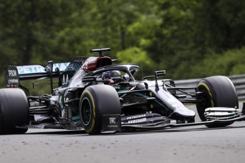 Mercedes driver Lewis Hamilton of Britain steers his car during the Hungarian Formula One Grand Prix race at the Hungaroring racetrack in Mogyorod, Hungary, Sunday, July 19, 2020. (Mark Thompson/Pool via AP)