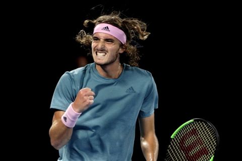 Greece's Stefanos Tsitsipas reacts after winning a point against Switzerland's Roger Federer during their fourth round match at the Australian Open tennis championships in Melbourne, Australia, Sunday, Jan. 20, 2019. (AP Photo/Mark Schiefelbein)