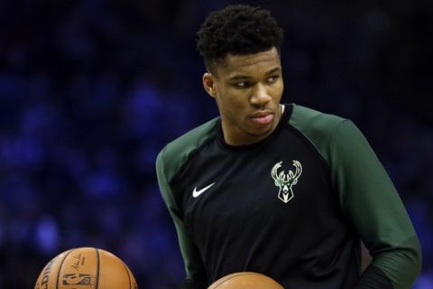 Milwaukee Bucks' Giannis Antetokounmpo warms up before the second half of an NBA basketball game against the Washington Wizards Wednesday, Feb. 6, 2019, in Milwaukee. (AP Photo/Aaron Gash)