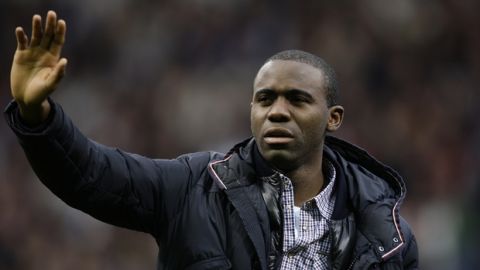 Bolton's Fabrice Muamba waves to supporters as he returns to The Reebok Stadium before his team's English Premier League soccer match against Tottenham, in Bolton, England, Wednesday, May 2, 2012. The 24-year-old has made a remarkable recovery since collapsing during the FA Cup tie between the same two teams at White Hart Lane on March 17.(AP Photo/Jon Super)