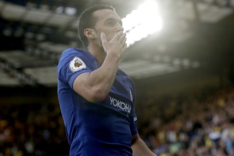 Chelsea's Pedro celebrates scoring his side's first goal during the English Premier League soccer match between Chelsea and Watford at Stamford Bridge stadium in London, Saturday, Oct. 21, 2017. (AP Photo/Matt Dunham)