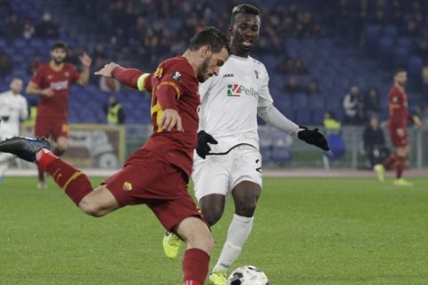 Roma's Alessandro Florenzi, left, and Wolfsberger's Anderson Niangbo vie for the ball during their Group J, Europa League Soccer match between Roma and Wolfsberg at Rome's Olympic Stadium, Thursday, Dec. 12, 2019. (AP Photo/Gregorio Borgia)