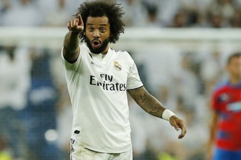 Real's Marcelo celebrates after scoring his side's second goal during the Champions League, group G, soccer match between Real Madrid and Viktoria Plzen at the Santiago Bernabeu stadium in Madrid, Spain, Tuesday Oct. 23, 2018. (AP Photo/Paul White)