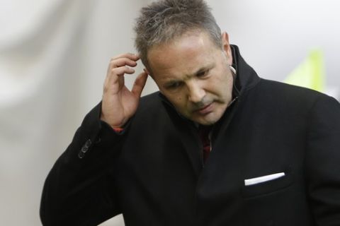 AC Milan coach Sinisa Mihailovic gestures as he walks prior to the start of a Serie A soccer match between AC Milan and Bologna, at the San Siro stadium in Milan, Italy, Wednesday Jan. 6, 2016. (AP Photo/Luca Bruno)