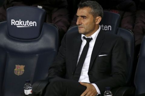 Barcelona's head coach Ernesto Valverde sits on the bench during a Spanish La Liga soccer match between Barcelona and Mallorca at Camp Nou stadium in Barcelona, Spain, Saturday, Dec. 7, 2019. (AP Photo/Joan Monfort)