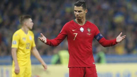 Portugal's Cristiano Ronaldo gestures during the Euro 2020 group B qualifying soccer match between Ukraine and Portugal at the Olympiyskiy stadium in Kyiv, Ukraine, Monday, Oct. 14, 2019. (AP Photo/Efrem Lukatsky)