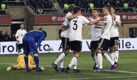Germany's players celebrate their first goal against Azerbaijan during their World Cup Group C qualifying match at the Tofig Bahramov Stadium in Baku, Azerbaijan, Sunday March 26, 2016. (AP Photo/Aziz Karimov)