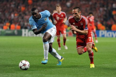 Manchester City's Micah Richards left, and Bayern Munich's Frank Ribery battle for the ball during the Champions League group D soccer match at the Etihad Stadium in Manchester, England, Wednesday, Oct. 2, 2013. (AP Photo/Clint Hughes)