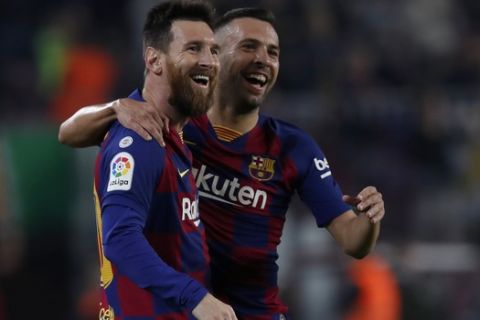 Barcelona's Lionel Messi celebrates his goal with Barcelona's Jordi Alba z during the Spanish La Liga soccer match between FC Barcelona and Valladolid CF at the Camp Nou stadium in Barcelona, Spain, Tuesday, Oct. 29, 2019. (AP Photo/Joan Monfort)