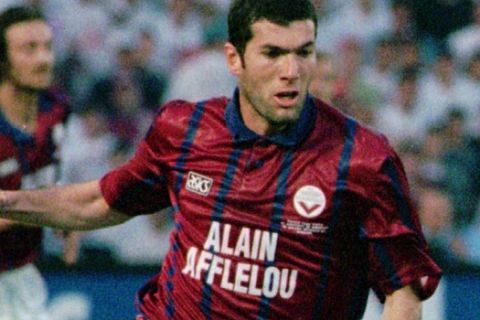 ** FILE ** Girondins Bordeaux midfielder Zinedine Zidane, seen in action against Bayern Munich during the final of the UEFA Cup in this May 15, 1996 file photo. Zidane said on Wednesday April 26, 2006 that his retirement from professional soccer after the World Cup in Germany was a considered decision, which would allow Real Madrid to make plans for next season.  (AP Photo/Michel Spingler)