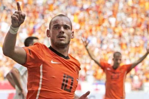 FILE - In this Saturday June 5, 2010 file photo Wesley Sneijder of The Netherlands celebrates scoring during the friendly soccer match Netherlands versus Hungary at ArenA stadium in Amsterdam, Netherlands. Midfielder Wesley Sneijder is retiring from international football after 15 years and a record 133 appearances for the Netherlands. The Dutch football association announced the retirement Sunday after new coach Ronald Koeman visited 33-year-old Sneijder in Qatar, where he plays for Al Gharafa. (AP Photo/Peter Dejong)