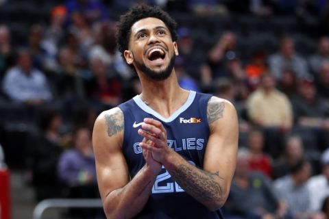 Memphis Grizzlies guard Tyler Dorsey (22) reacts to a play against the Detroit Pistons in the first half of an NBA basketball game in Detroit, Tuesday, April 9, 2019. (AP Photo/Paul Sancya)
