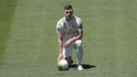 Serbia forward Luka Jovic poses during his official presentation after signing for Real Madrid at the Santiago Bernabeu stadium in Madrid, Spain, Wednesday, June 12, 2019. The 21-year-old Jovic, who scored 17 goals in 32 Bundesliga games for Eintracht Frankfurt last season, agreed to a six-year deal with Madrid. (AP Photo/Manu Fernandez)