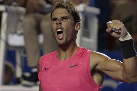 Spain's Rafael Nadal celebrates defeating Serbia's Miomir Kecmanovic in the second round of competition at the Mexican Tennis Open in Acapulco, Mexico, in the early morning hours of Thursday, Feb. 27, 2020. (AP Photo/Rebecca Blackwell)