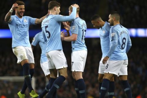 Manchester City players celebrated a goal against Wolverhampton Wanderers during the English Premier League soccer match between Manchester City and Wolverhampton Wanderers at the Etihad Stadium in Manchester, England, Monday, Jan. 14, 2019. (AP Photo/Dave Thompson)