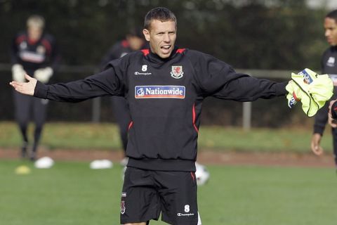 Wales' captain Craig Bellamy gestures during a practice session of the national soccer team of Wales in Neuss, western Germany, Tuesday Oct. 14, 2008. Wales faces the soccer team of Germany on Wednesday in a World Cup group 4 qualifying match. (AP Photo/Frank Augstein)