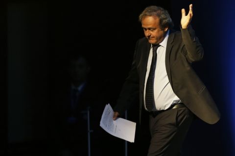 Former UEFA President Michel Platini, waves after his speech during the vote for the new UEFA president a in Athens, on Wednesday, Sept. 14, 2016. European soccer federations will elect  Wednesday a new UEFA president to replace Michel Platini, who is serving a four-year ban from the sport. (AP Photo/Thanassis Stavrakis)