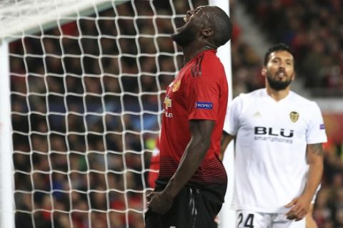 ManU forward Romelu Lukaku reacts after missing a chance to score during the Champions League group H soccer match between Manchester United and Valencia at Old Trafford Stadium in Manchester, England, Tuesday Oct. 2, 2018. (AP Photo/Jon Super)