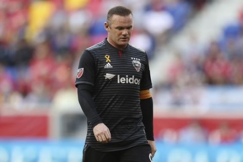 D.C. United forward Wayne Rooney (9) walks over to take a corner kick during the first half of an MLS soccer match against the New York Red Bulls, Sunday, Sept. 29, 2019, in Harrison, N.J. The match ended in a 0-0 draw. (AP Photo/Steve Luciano)