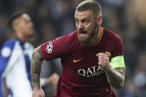 FILE - In this March 6, 2019 file photo, Roma midfielder Daniele De Rossi celebrates after scoring his side's first goal during the Champions League round of 16, 2nd leg, soccer match between FC Porto and AS Roma at the Dragao stadium in Porto, Portugal. Roma captain Daniele De Rossi surprisingly announced on Tuesday, May 14, 2019 he is leaving his hometown club after 18 years. (AP Photo/Luis Vieira, file)