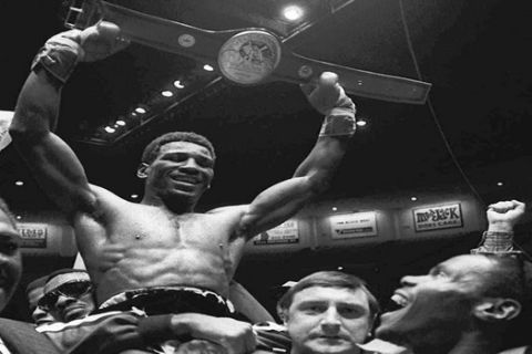 FILE - In this Nov. 28, 1980 file photo, Matthew Saad Muhammad holds up his light heavyweight title belt as he is carried around the ring after knocking out challenger Lotie Mwale in their title fight in San Diego.  Matthew Saad Muhammad, who was abandoned as a child and rose to become "one of the most exciting boxers of all time" and later an advocate for the homeless after a stay in a shelter himself, died Sunday, May 25, 2014 at a Philadelphia hospital. He was 59.  (AP Photo/File)