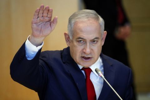 Israel's Prime Minister Benjamin Netanyahu delivers his speech to French Finance Minister Bruno Le Maire during their meeting at Bercy Economy Ministry, in Paris, Wednesday, June 6, 2018. Netanyahu met French Finance Minister Bruno Le Maire, who is pushing to maintain European trade with Iran allowed under the 2015 deal curbing Iranian nuclear activities.(AP Photo/Francois Mori)
