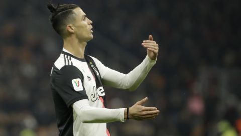 Juventus' Cristiano Ronaldo reacts after a missed scoring opportunity during an Italian Cup soccer match between AC Milan and Juventus at the San Siro stadium, in Milan, Italy, Thursday, Feb. 13, 2020. (AP Photo/Luca Bruno)