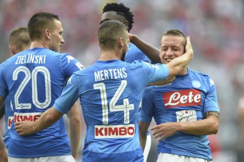 From left: Piotr Sebastian Zielinski,  Dries Mertens, Madou Diawara and goal-scorer Emanuele Giaccherini of Naples celebrate the 2nd goal during the match for the third place of the Audi Cup between FC Bayern Munich and SSC Napoli, in Munich, Wednesday, Aug. 2, 2017.   (Andreas Gebert/dpa via AP)