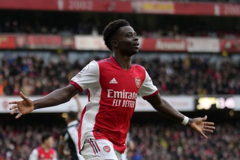 Arsenal's Bukayo Saka celebrates after scoring his side's opening goal during the English Premier League soccer match between Arsenal and Newcastle United at Emirates stadium in London, Saturday, Nov. 27, 2021. (AP Photo/Kirsty Wigglesworth)