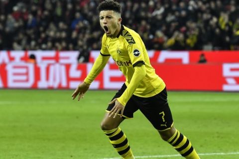 Dortmund's Jadon Sancho celebrates before his goal was cancelled during the German Bundesliga soccer match between Bayer Leverkusen and Borussia Dortmund in Leverkusen, Germany, Saturday, Feb. 8, 2020. Leverkusen defeated Dortmund with 4-3. (AP Photo/Martin Meissner)