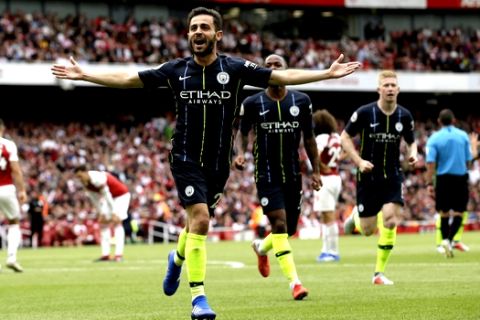 Manchester City's Bernardo Silva celebrates after scoring his side's second goal during the English Premier League soccer match between Arsenal and Manchester City at the Emirates stadium in London, England, Sunday, Aug. 12, 2018. (AP Photo/Tim Ireland)