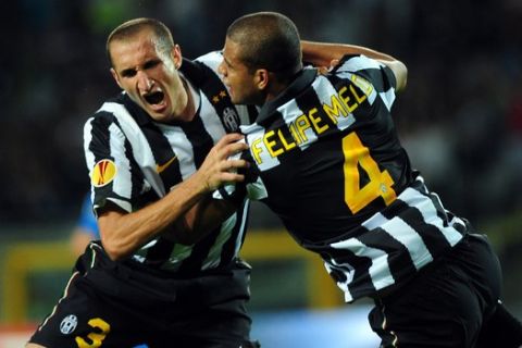 Juventus' Giorgio Chiellini, left, celebrates with teammate Felipe Melo after scoring second goal during an Europa League, Group A, first-leg soccer match between Juventus and Lech Poznan , at the Turin stadium, Italy, Thursday, Sept. 16 2010. (AP Photo/Massimo Pinca)