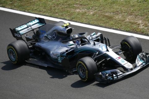 Mercedes driver Valtteri Bottas of Finland steers his car during a free practice at the Barcelona Catalunya racetrack in Montmelo, just outside Barcelona, Spain, Friday, May 11, 2018. The Formula One race will take place on Sunday. (AP Photo/Manu Fernandez)