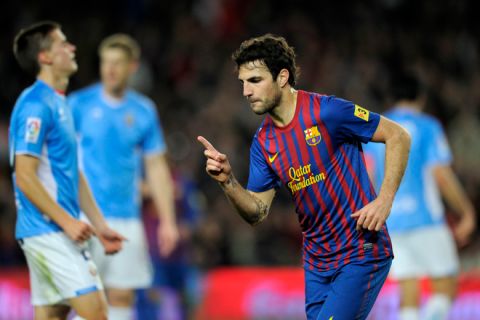 Barcelona's forward Cesc Fabregas celebrates after scoring a goal during the Spanish Cup football match FC Barcelona vs Osasuna on January 4, 2012 at Camp Nou stadium in Barcelona. AFP PHOTO/ LLUIS GENE (Photo credit should read LLUIS GENE/AFP/Getty Images)