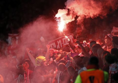 Cologne supporters light fireworks during the Europa League group H soccer match between Arsenal and FC Cologne at the Emirates stadium in London, England, Thursday, Sept. 14, 2017 . (AP Photo/Kirsty Wigglesworth)