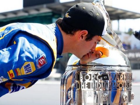 INDIANAPOLIS, IN - MAY 30:  Alexander Rossi of the United States, driver of the #98 Andretti Herta Autosport Honda Dallara, kisses the Borg-Warner trophy during a photoshoot after winning the 100th running of the Indianapolis 500 at Indianapolis Motorspeedway on May 30, 2016 in Indianapolis, Indiana.  (Photo by Jamie Squire/Getty Images)