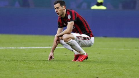 AC Milan's Nikola Kalinic kneels on the pitch after missing a scoring chance during the Serie A soccer match between AC Milan and Torino at the San Siro stadium in Milan, Italy, Sunday, Nov. 26, 2017. (AP Photo/Antonio Calanni)