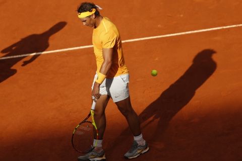 Rafael Nadal from Spain walks along the court during a Madrid Open tennis tournament match with Dominic Thiem from Austria in Madrid, Spain, Friday, May 11, 2018. Thiem won 7-5, 6-3. (AP Photo/Francisco Seco)