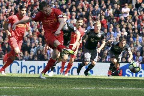 Liverpool's James Milner misses a penalty during their English Premier League soccer match against Southampton at Anfield, Liverpool, England, Sunday, May 7, 2017. (Peter Byrne/PA via AP)