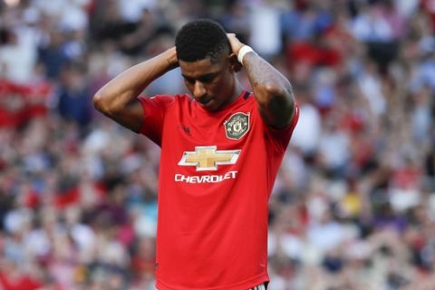 Manchester United's Marcus Rashford reacts after missing to score on a penalty kick during the English Premier League soccer match between Manchester United and Crystal Palace at Old Trafford in Manchester, England Saturday, Aug, 24, 2019. (AP Photo/Alastair Grant)